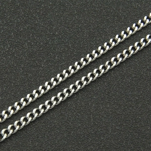Macro shot of double layered polished silver curb chain links with metallic finish