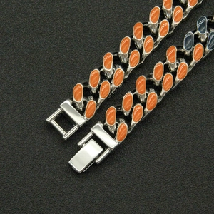 Silver Cuban link necklace with orange enamel teardrop inlay and secure box clasp
