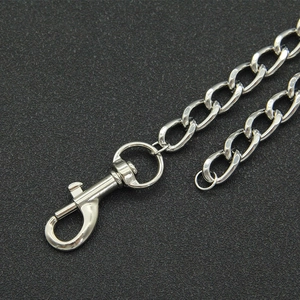Macro shot of silver polished Cuban link chain and lobster clasp with shiny mirror finish