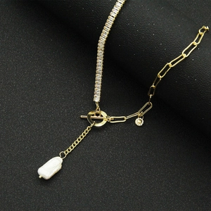 Golden Y-shaped choker featuring crystal chain, OT buckle, and baroque pearl drop