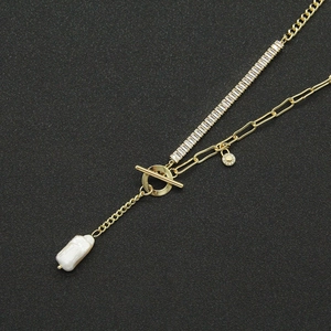 Elegant gold choker necklace with OT buckle, rectangular zircons and baroque pearl pendant