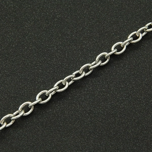 Polished silver metal cuban link chain with oval interlocking loops on black background