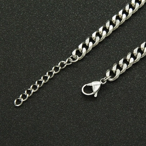 Macro detail of silver cuban chain with lobster clasp and adjustable extension chain