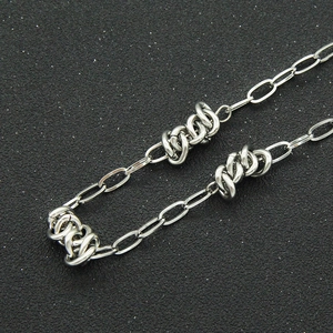 Modern silver Cuban chain necklace with minimalist oval links and industrial knots