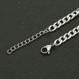 Macro shot of silver Cuban link chain with secure lobster clasp and adjustable extension