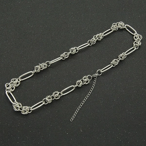 Detail view of silver linked chain necklace with lobster clasp and extension chain