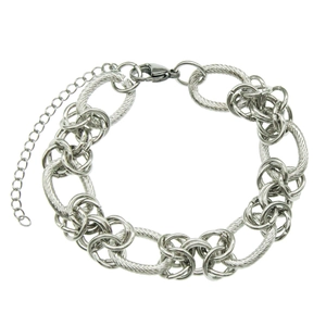 Vintage silver metal link bracelet with textured rings and lobster clasp on white background
