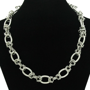 Industrial silver chunky chain necklace with twisted rope texture rings on a black bust