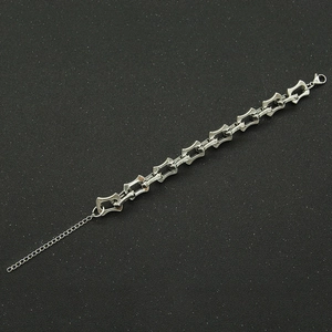 Close-up of a silver geometric hollow link chain with adjustable lobster clasp