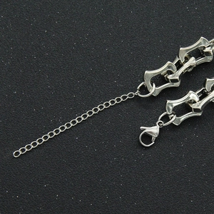 Close-up of industrial geometric link chain with adjustable lobster clasp and extender