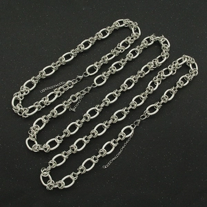 Vintage silver chunky chain necklaces with lobster clasp on a black textured surface