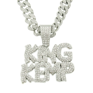 Detailed close-up of King Kemp iced-out hip hop necklace with paved cubic zirconia stones