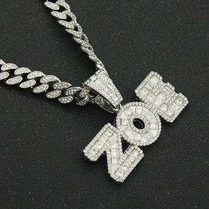 Silver iced out Cuban link necklace with NON letter pendant and pavé rhinestones