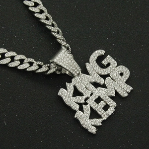 Hip hop silver Cuban link necklace featuring a bold iced out KING letter pendant for men