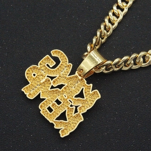 Detail of hip-hop golden Cuban chain with a large iced-out micro-pave zircon pendant