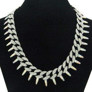 Close-up of silver Cuban link chain with rhinestones and iridescent spikes on display