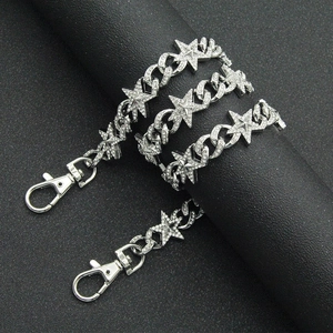 Close-up of hip hop cuban chain with rhinestone encrusted stars and lobster clasp