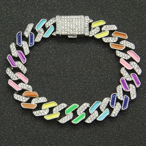 Macro detail of rainbow colorful Cuban link bracelet with sparkling diamond settings