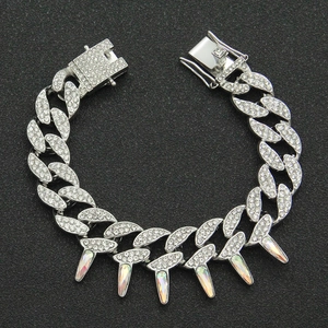 Close-up of iced out Cuban link chain with iridescent AB colorful spiked charms