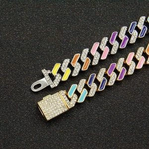 Close-up of hip hop cuban link chains with colorful enamel inlay and sparkling rhinestones