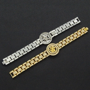 Detailed view of hip hop chains with spinning dollar sign and iced-out paved rhinestones