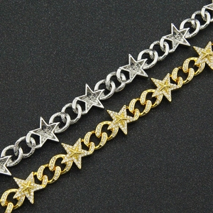 Macro view of gold and silver hip hop star chains with cubic zirconia inlays
