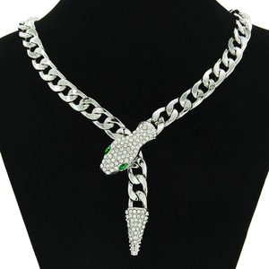 Silver snake necklace with cuban chain and sparkling rhinestones on black bust
