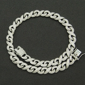 Detail of hip hop infinity link chain featuring paved cubic zirconia on silver plating