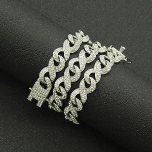 Close-up of iced out hip hop silver chain with sparkling infinity link design and fold-over clasp