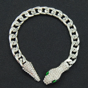 Silver Cuban chain snake bracelet with pave crystals and green gemstone eyes