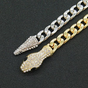 Cuban link snake necklace in gold and silver tones with shimmering pavé crystal settings