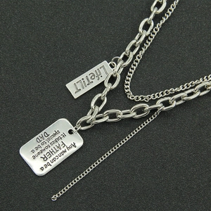 Double-layered silver chain necklace featuring engraved rectangular dog tags for men