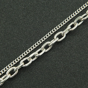 Punk style double layered silver necklace with curb and cable chain details