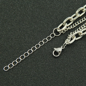 Detail of silver double layered chain necklace with lobster clasp and adjustable link