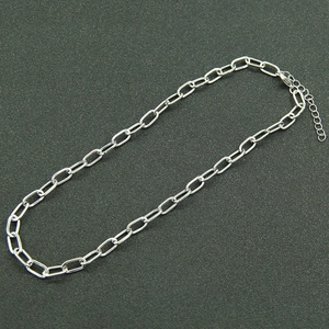 Detail view of silver double-layered paperclip chain necklace with lobster clasp
