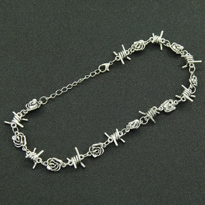 Silver barbed wire necklace with metallic 3D roses and adjustable lobster clasp closure