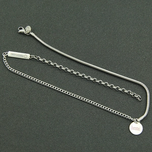 Layered stainless steel necklace with snake chain and engraved smile pendant charms