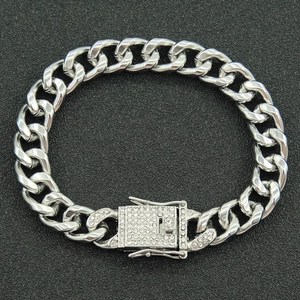 Macro shot of silver Cuban link chain featuring a luxury micro-paved diamond square buckle