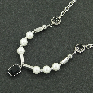 Unisex titanium steel pearl necklace with black gemstone pendant and silver O-chain details