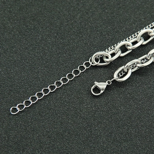 Close-up of double-layer silver steel Cuban chain necklace with adjustable lobster clasp