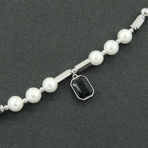 Hip hop pearl necklace with a rectangular black gemstone pendant and silver hardware
