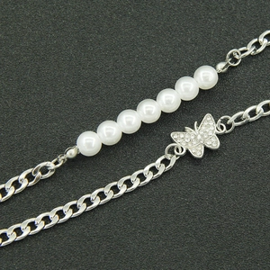 Chic silver Cuban chain necklace with white pearls and a sparkling crystal butterfly pendant