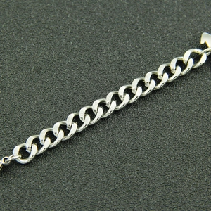 Macro view of polished silver cuban chain links with modern industrial style texture