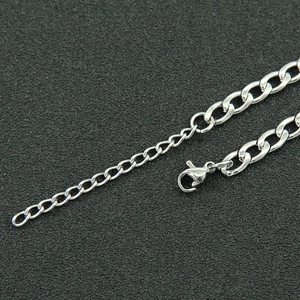 Detail shot of silver Cuban chain necklace with lobster clasp and extension chain