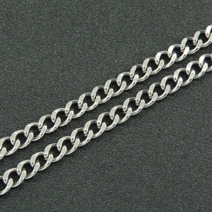 Detailed macro view of polished silver cuban chain links with metallic glossy finish