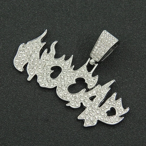Macro detail of iced-out Lucky letter pendant with flame design and heart cutout