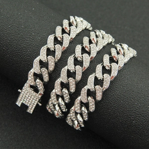 Macro shot of silver hip-hop Cuban link bracelet with full pave iced out rhinestones