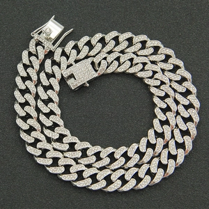 Macro view of 13mm silver Cuban link necklace with iced-out pave rhinestones and box clasp