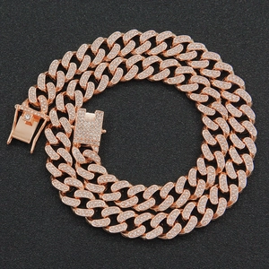 Close-up of 13mm rose gold iced-out Cuban link chain with detailed crystal buckle clasp