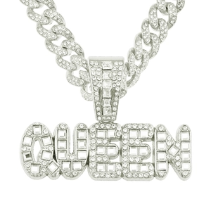 Close-up of silver-plated QUEEN pendant with baguette diamonds and iced-out Cuban chain